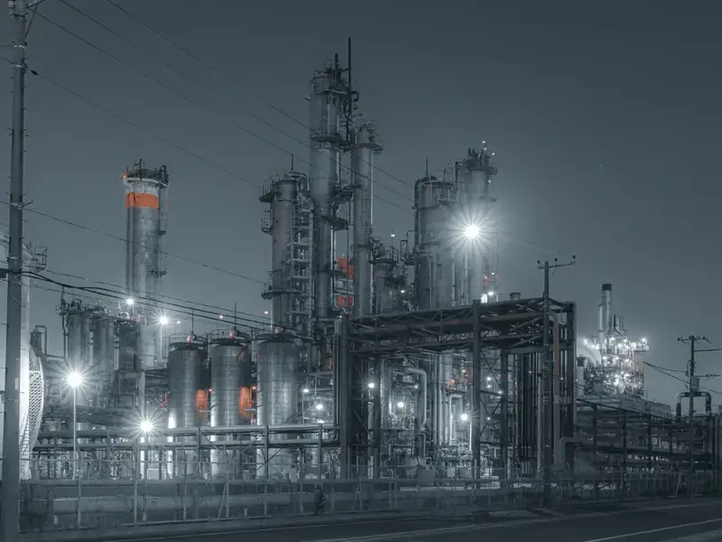Process columns at a chemical plant at night